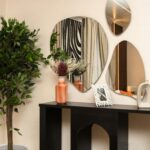 small entryway with slim console table mirror and storage